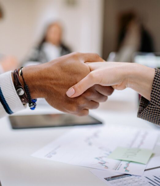 Handshake over financial charts